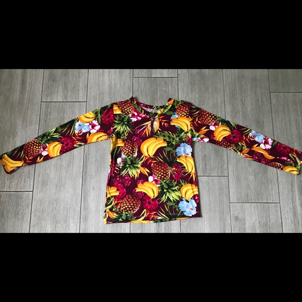A cute, colorful, Hawaiian, long-sleeved top.